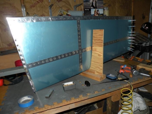 Bottom right skin riveted to HS-702 spar and HS-708 center main rib.