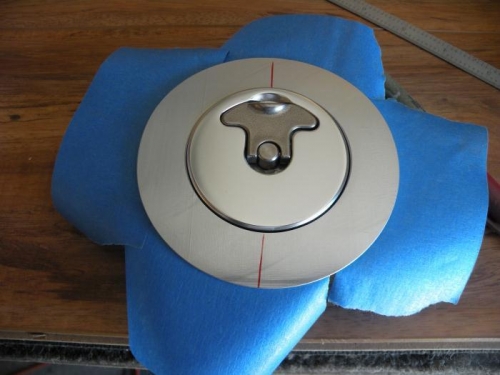 Center line marke on left fuel cap, and tape ready for installation on skin.