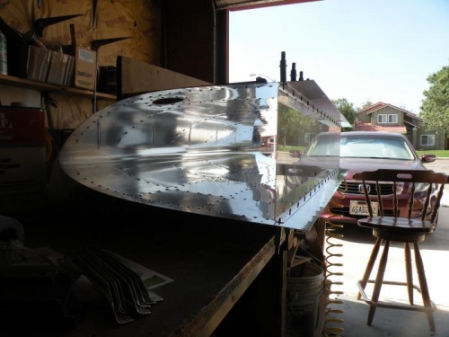 Leading edge laying horizontal on bench, ready for countersinking skin to baffle rivet holes.