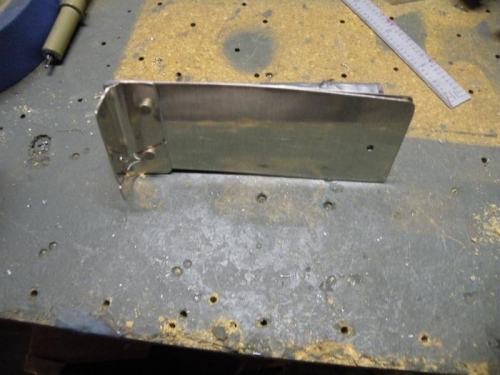 Concentric #40 hole in top sheet for locating pilot hole in a fairing or cover.