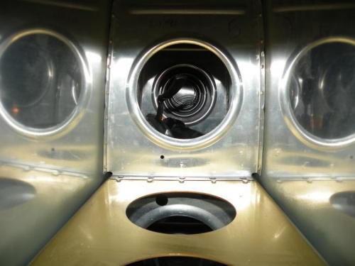 POP rivet puller in place for the third rib inboard. Note completed rivets on second rib.