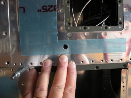 Drilled the tiedown hole in the bottom of the leading edge skin; better late than never...