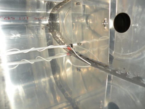 Wire from outboard plate cut to length and terminated. Inboard wire marked for cutting.