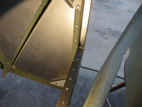 Skin peeled back for installation of the forward skin stiffener attach angle.