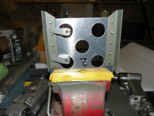 Setup for squeezing the rivets attaching the angles to the brake pedals.