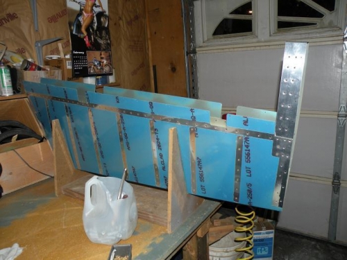 Two rivets top and bottom holding the counterbalance skin in place. Ready for the skeleton!