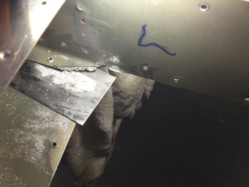 After cutting with a small burr. Note that the flange is shimmed up from the skin.