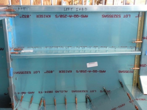 Drilling the forward and aft flanges of the F-720 armrests.