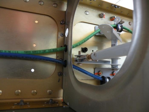 Clearance between tubing and bellcrank hardware.