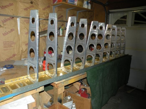 Ten of fourteen ribs riveted to right spar.