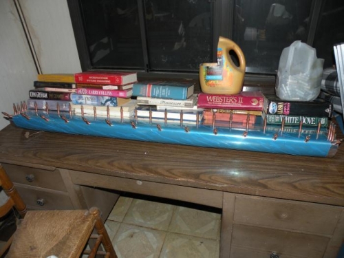 Weighted  down on a very flat surface for riveting the counterbalance and bottom skins to spar.