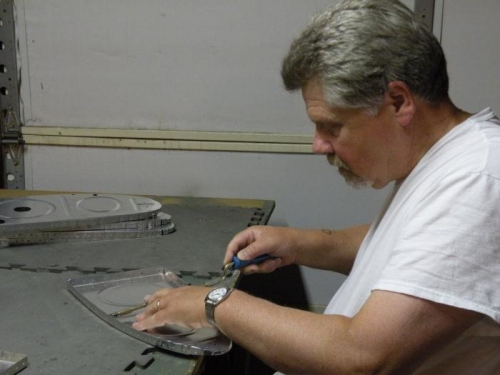 Deburring left tank rib rivet holes.