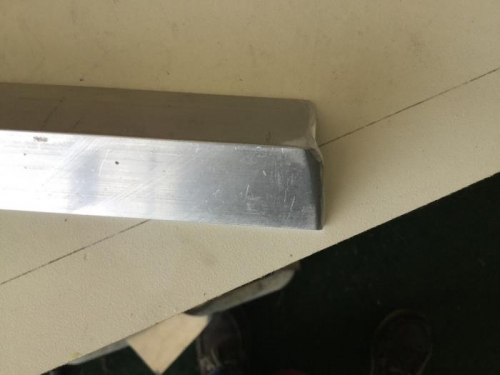 The vertical leg of the F-710B is releived slightly to clear the top flange tabs on the bulkhead.