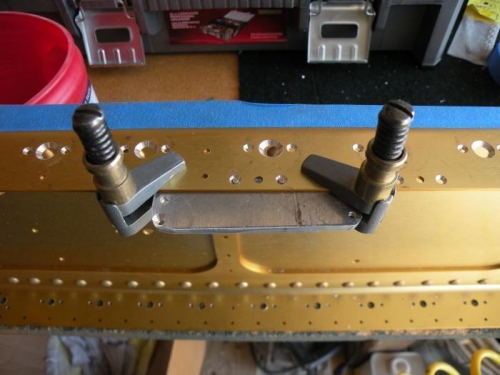 Modified jig for holes along the edge of the spar flange.