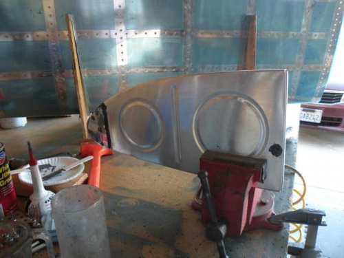 T-410 installed and sealed, and tooling hole filled with an AN470-6 rivet and sealed.