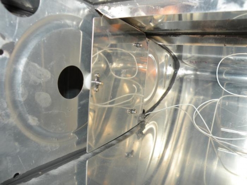 Outboard capacitance sender plate trimmed and permanently installed.