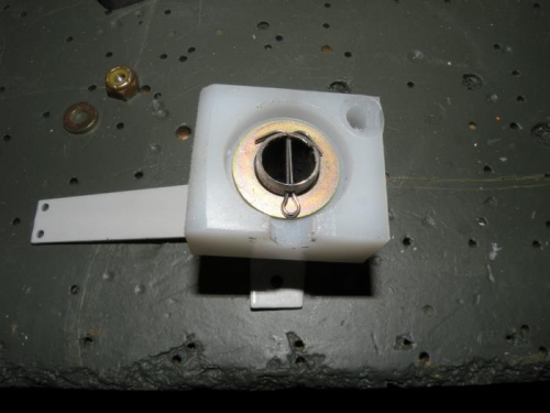 The aileron trim arm installed in its bearing block.