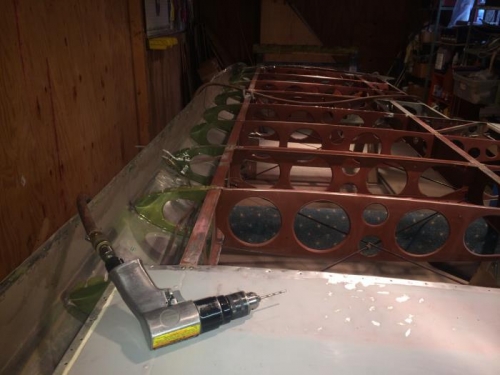 One side un-riveted.