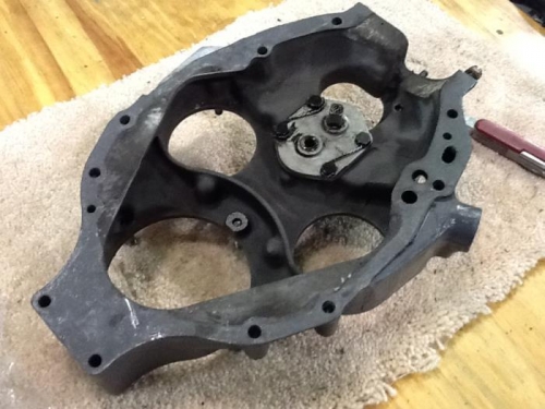 Rear engine cover with oil pump.