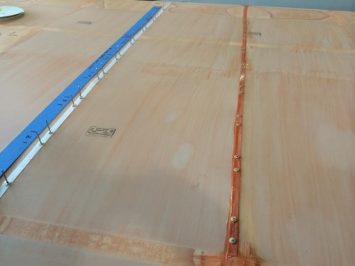 Rivets set, four coats Poly-Brush applied.