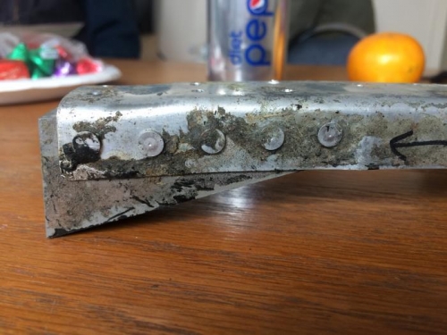 Brace end near mount where buckled.