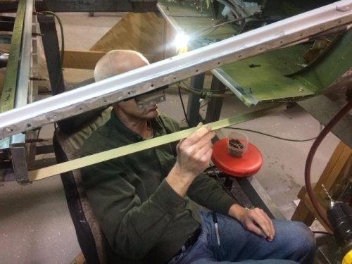 Bill down in the hole installing belly skin stiffeners that I previously fabricated.