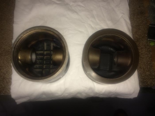 Beefed-up high compression piston on right.