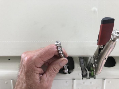 Ratchet and 3/8 socket left. Loose Phillips bit and vice grips right.