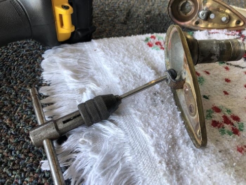 Tapping retainer screw holes.