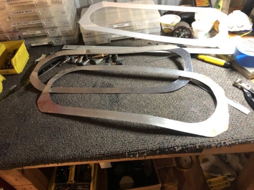 Old and new headliner skylight retainers..