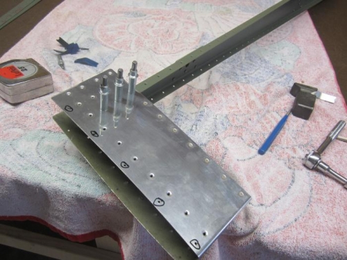 Rivet counterweight skin to rib