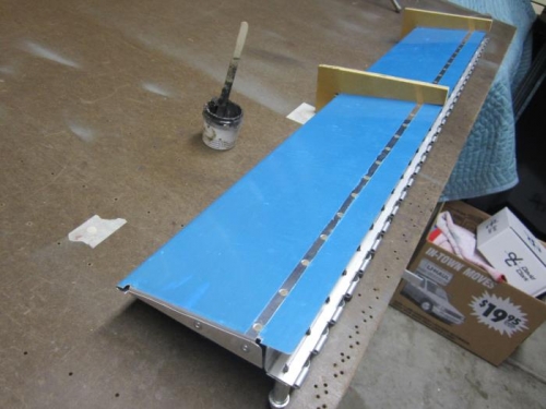 Lower skin riveted and foam ribs glued