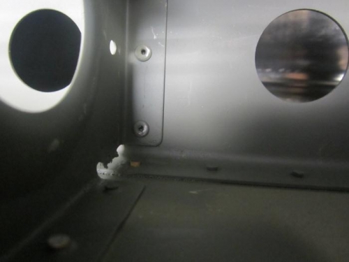 Rivet at removed tab