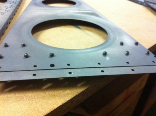 Step in metal thickness at attachment face.