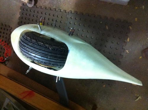Fairing fitted to main whel and spring assy. Rear view.