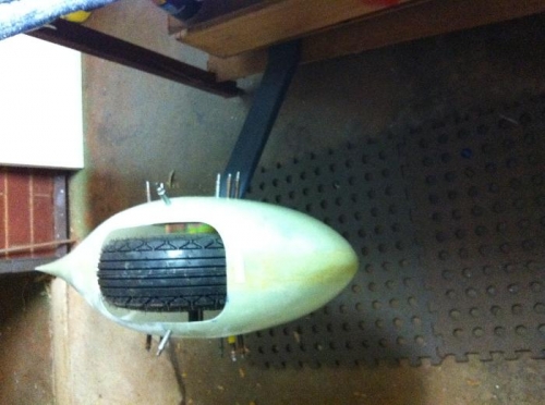 Fairing fitted to main whel and spring assy. Front view.