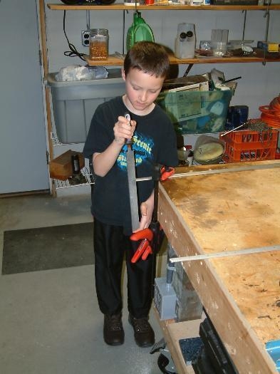 Mason putting the radius on the reinforcement bars.  He's a BIG help.
