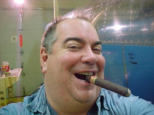 Big Joe sitting back and admiring the wings w/ a great cigar!