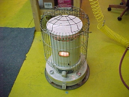 Kerosine heater cleaned and supporting a new wick....
