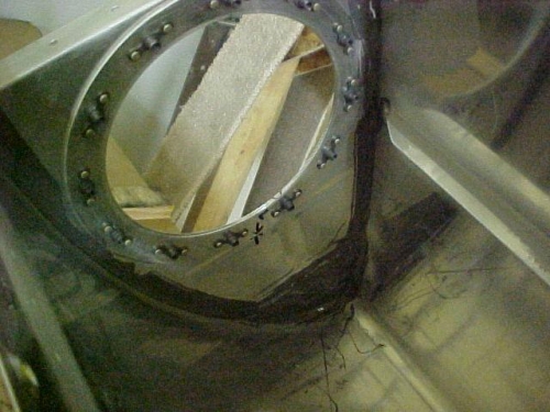 Inside of inboard rib showing access hole and T-410 reinforcement plate riveted