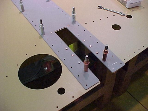 The F--904H plate is riveted on to the inside of the side skins.