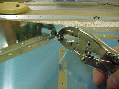 The vise grip dimpler works well in the confined areas of the flap ribs