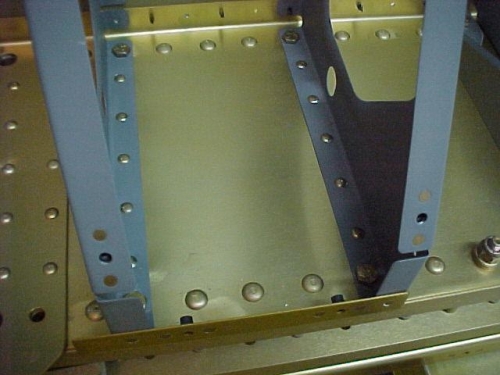Seat ribs riveted to the F-904 aft bulkhead