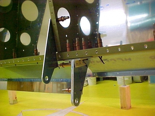 Aileron and flap brackets and gap fairings clecoed to wing frame