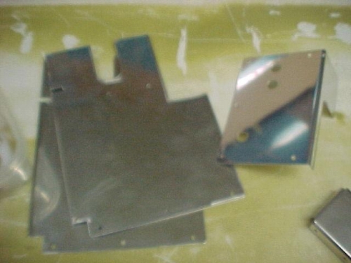 fuzzy picture of front floor plate and the cover plate for the throttle, mix and carb heat cables.