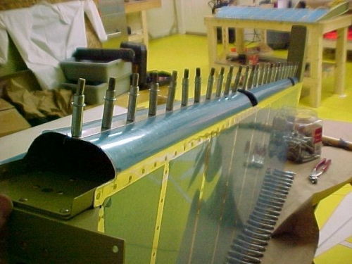 The Leading edge of the rudder after roll-forming with the broom handle and clecoed