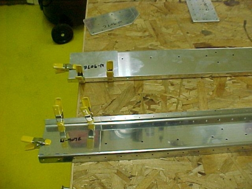 Doubler plates are clamped in position for drilling
