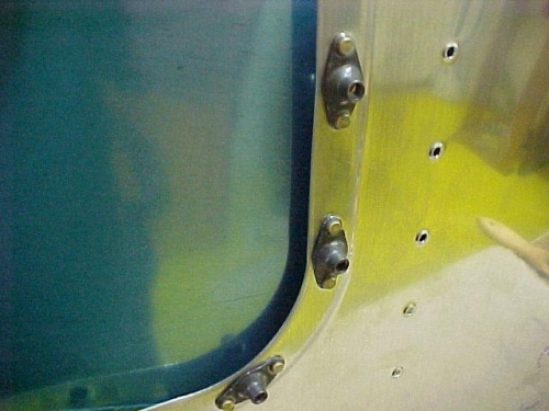 Plate nuts in place for access panels on bottom skin of wing