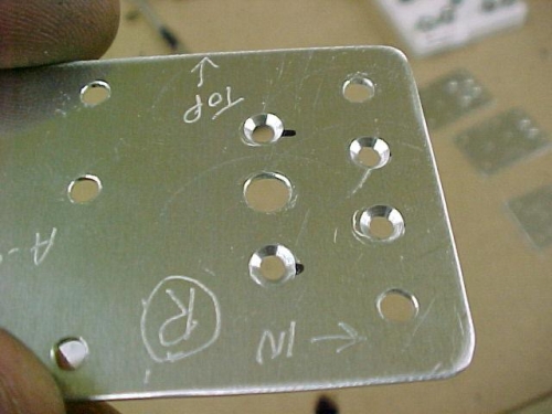 Reinforcing plates with certain holes countersunk