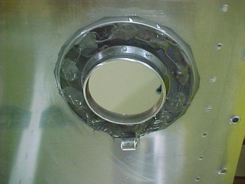 Fuel cap flange riveted.  T-914 clip shown at bottom of flange
